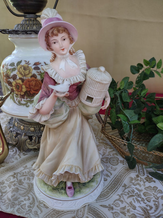 Napcoware Classic Gallery C-6640 Figurine Featuring a Colonial Young Lady with Bird